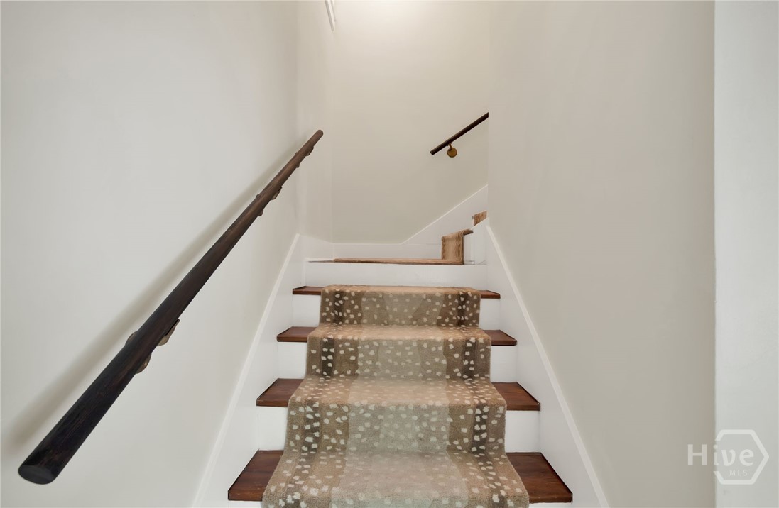 208 East 48th Street Savannah, GA 31405 - Photo 35 of 50 Stairs to the third floor master bedroom with ensuite and sitting room.