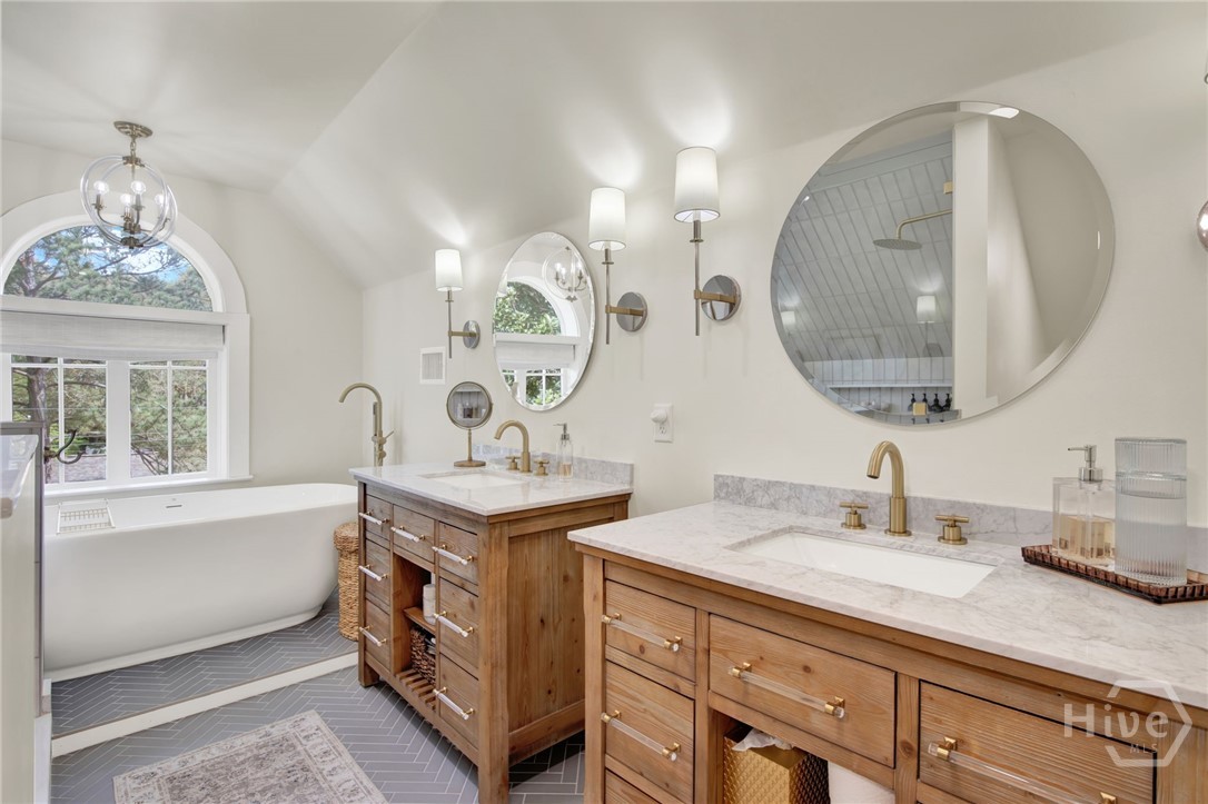 208 East 48th Street Savannah, GA 31405 - Photo 39 of 50 Master bath that was completely renovated. Double sinks, standing tub and custom Cabinets and lighting.