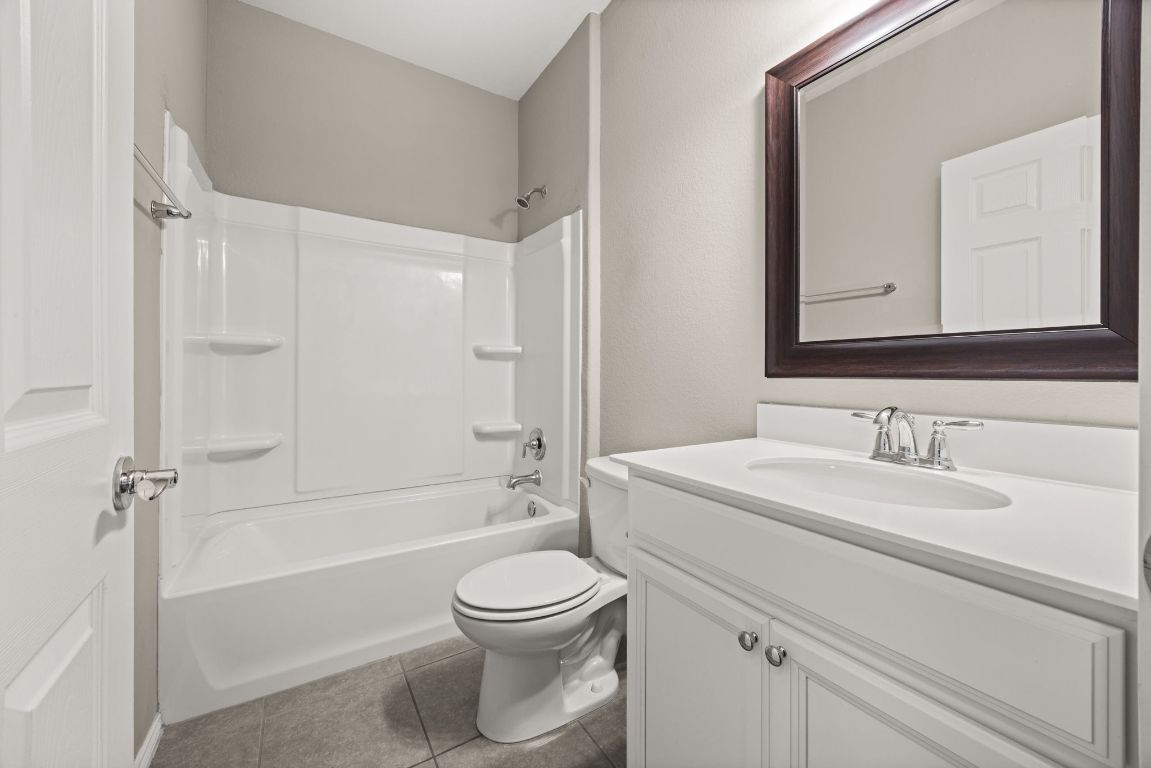 125 Hopen Cove Leander, TX 78641 - Photo 13 of 20 a bathroom with a sink a toilet and shower