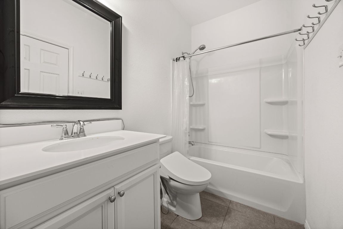 125 Hopen Cove Leander, TX 78641 - Photo 15 of 20 a bathroom with a sink a toilet and shower