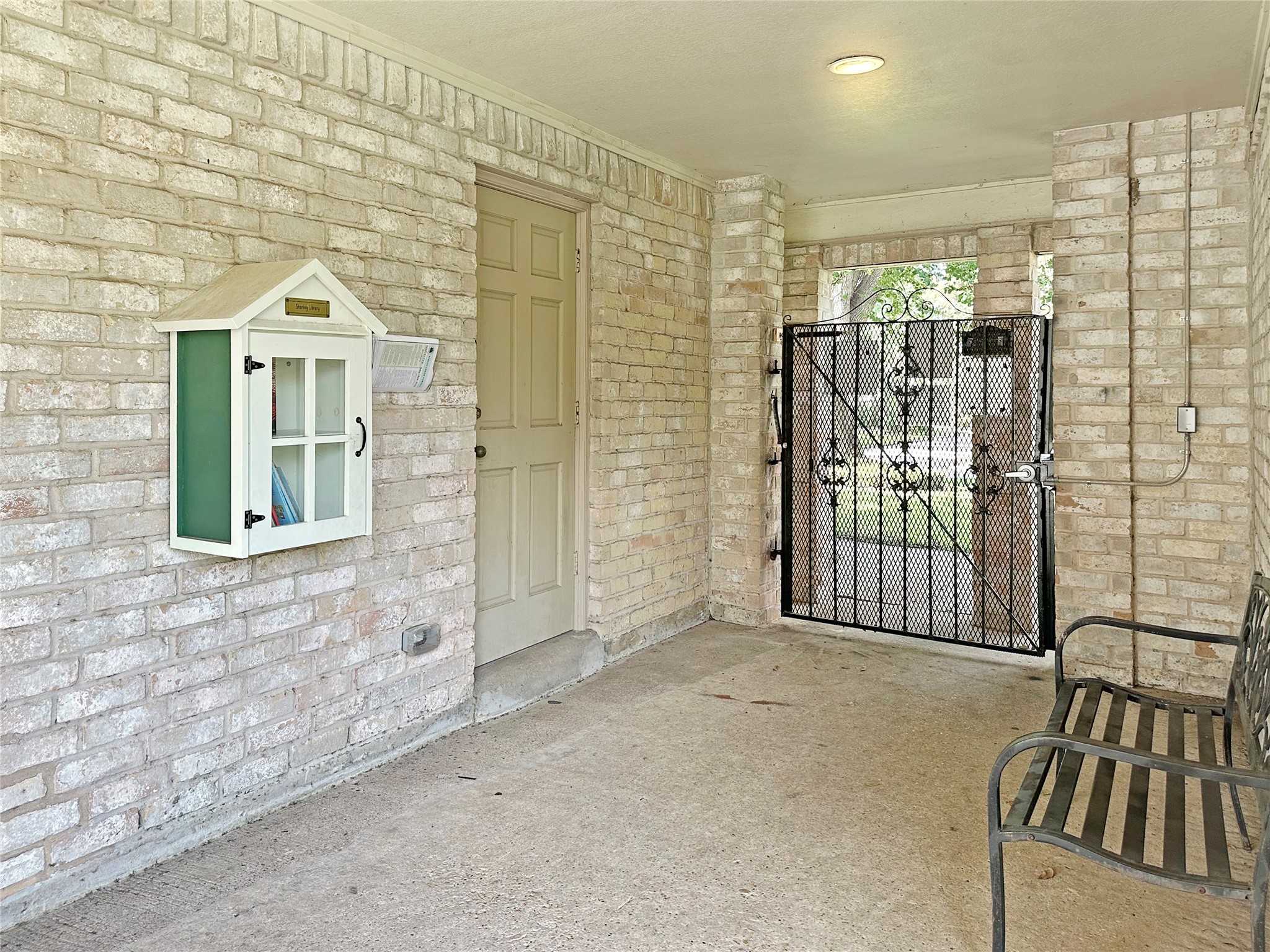 6511 Castle Pine Lane Spring, TX 77379 - Photo 45 of 49 Charming Little Free Library located near the clubhouse patio encourages neighbors of all ages to share books, connect with the community, and enjoy a relaxing outdoor reading spot near the heart of neighborhood activities.
