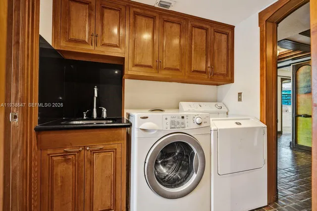 a dining hall with stainless steel appliances granite countertop a barbecue grill and couches chair with garden view