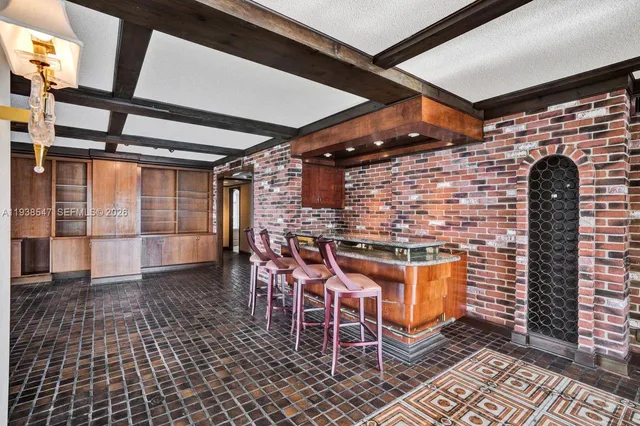 a lobby with furniture and floor to ceiling window