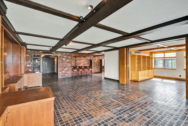 a view of a bedroom with closet and natural light