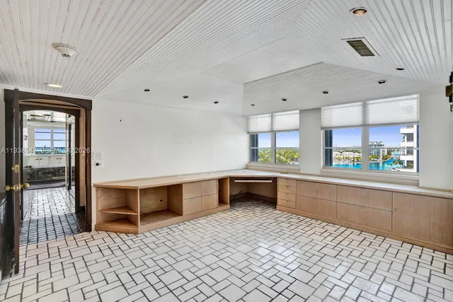 a view of swimming pool with outdoor seating and plants