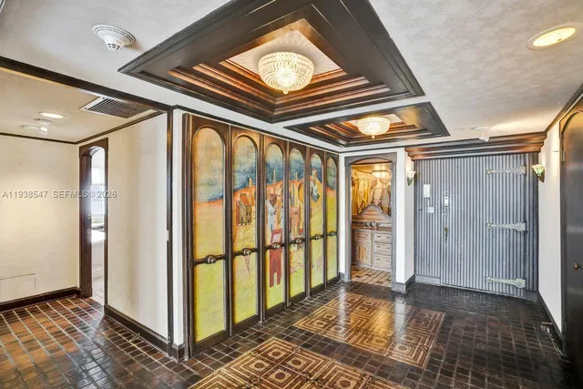 a kitchen with granite countertop a sink a counter top space cabinets and stainless steel appliances