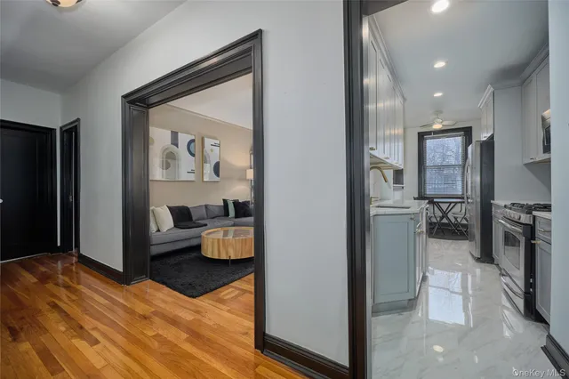 a view of a living room and entry way