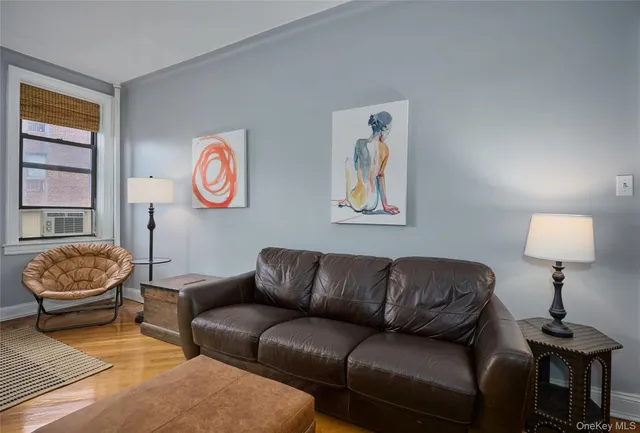 a living room with a couch and a window