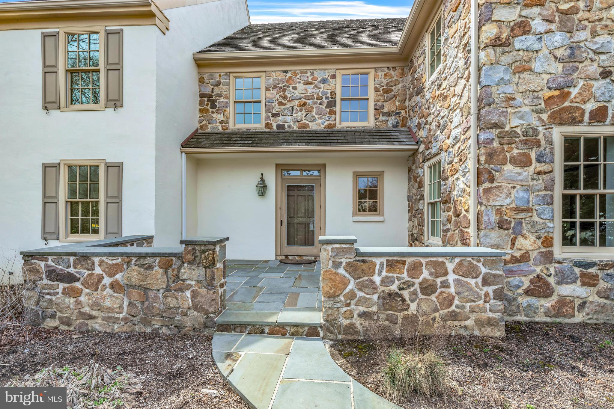 292 Church Road Devon, PA 19333 - Photo 19 of 21 a view of a brick house with large windows