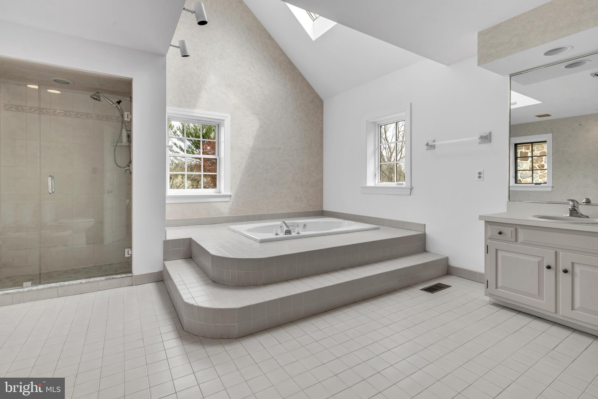 292 Church Road Devon, PA 19333 - Photo 10 of 21 a spacious bedroom with a bed and a window