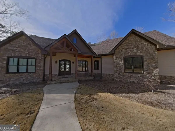 a front view of a house with garden