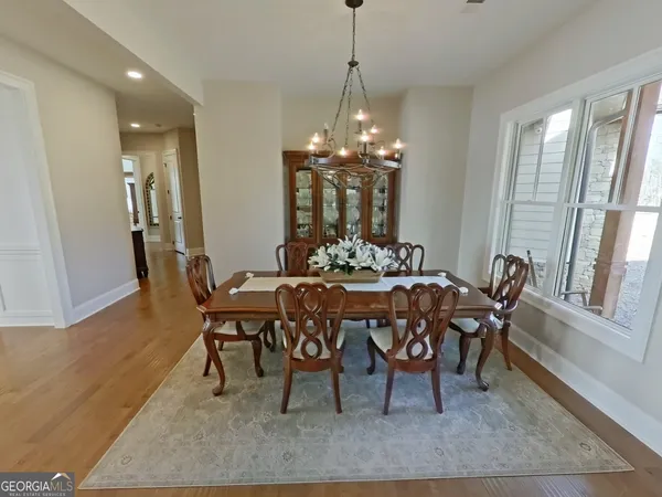 a view of a dining room with furniture and window
