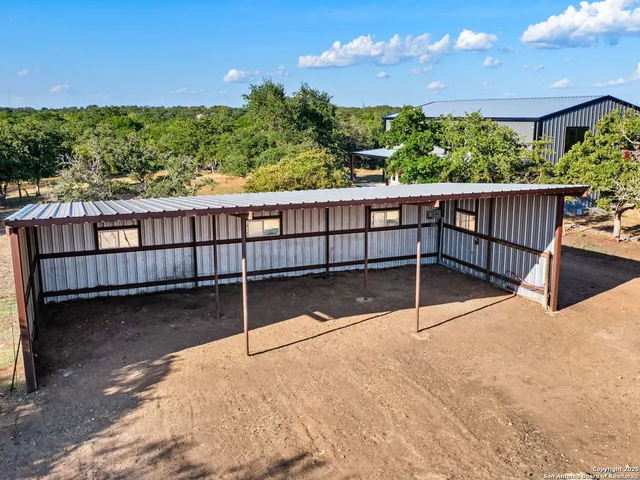 a view of a balcony with wooden floor and outdoor space