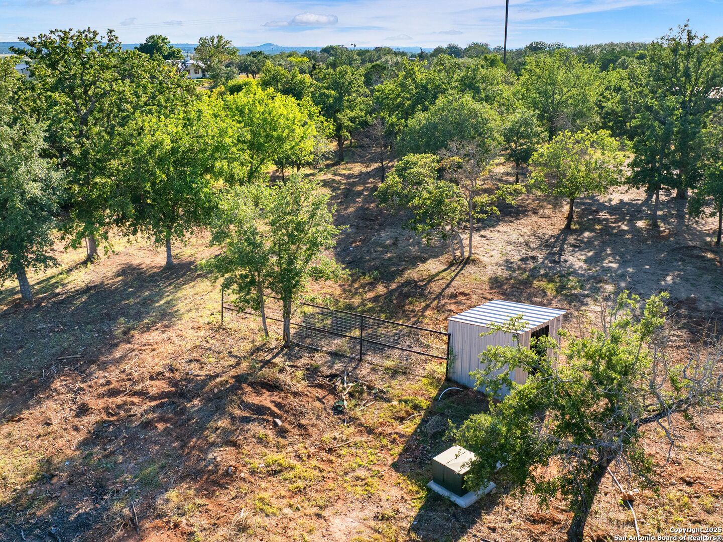 110 Moellering Road Fredericksburg, TX 78624 - Photo 18 of 20 a backyard of a house with lots of green space