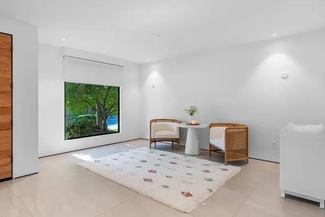 a bathroom with a toilet sink and shower