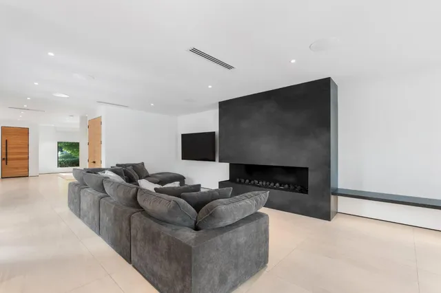 a kitchen with stainless steel appliances granite countertop a sink and a wooden floors