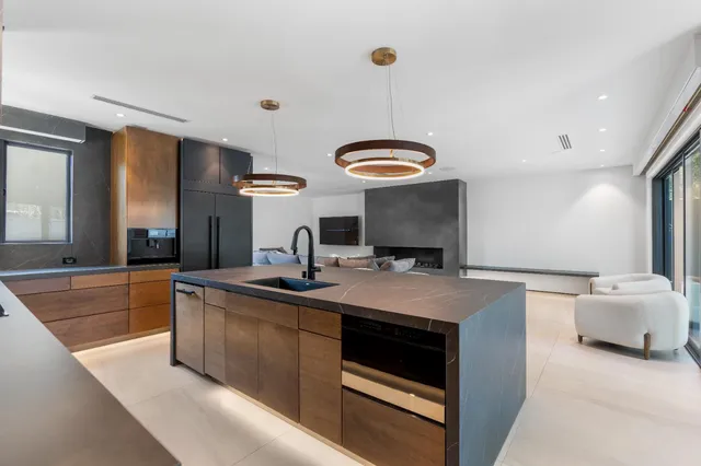 a room with a bed and a television