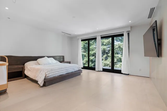 a bathroom with a sink double vanity and a mirror