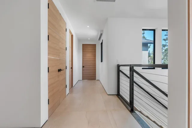 an aerial view of a house with garden space and sitting area