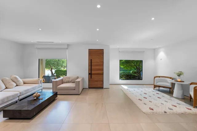 a living room with furniture a window and a couch