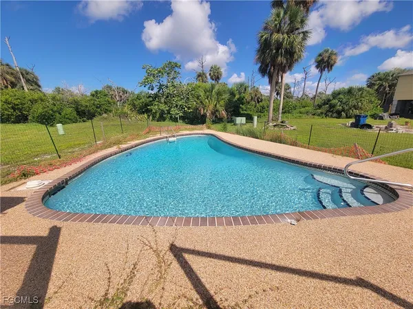 a view of a swimming pool and outdoor space