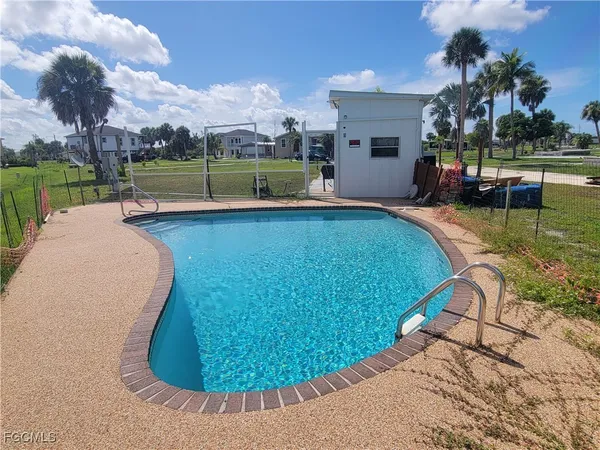 a view of a swimming pool with a lounge chairs
