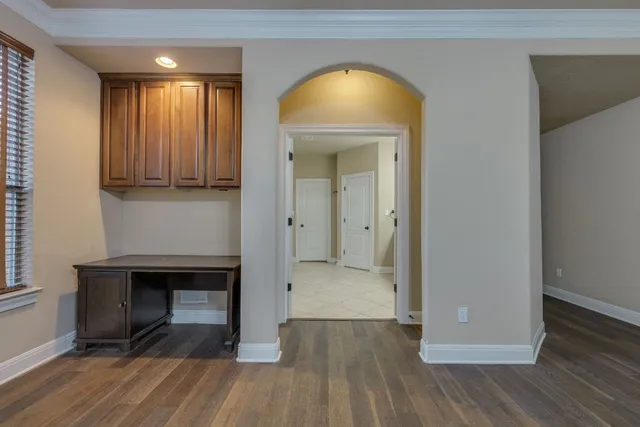 a bathroom with a granite countertop sink a large mirror and a shower