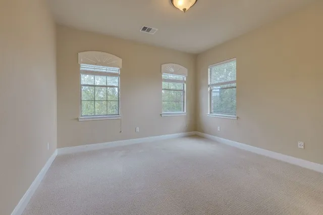 a bathroom with a sink toilet vanity and shower