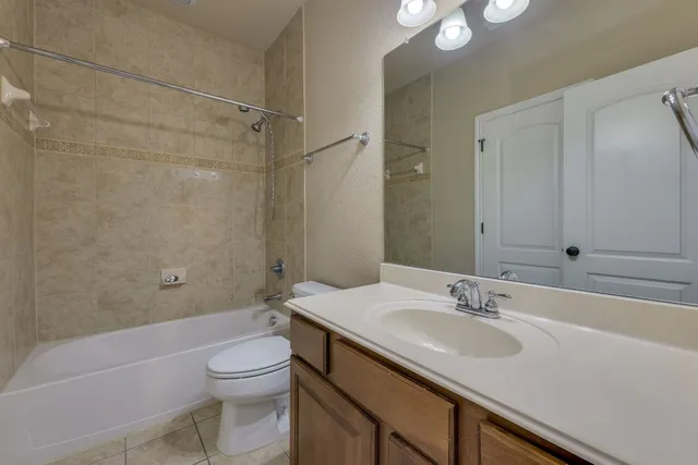 an empty room with window and wooden floor