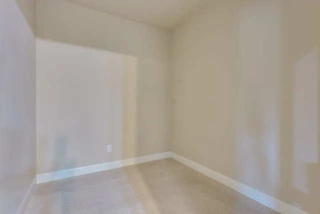 a view of yellow house with a yard