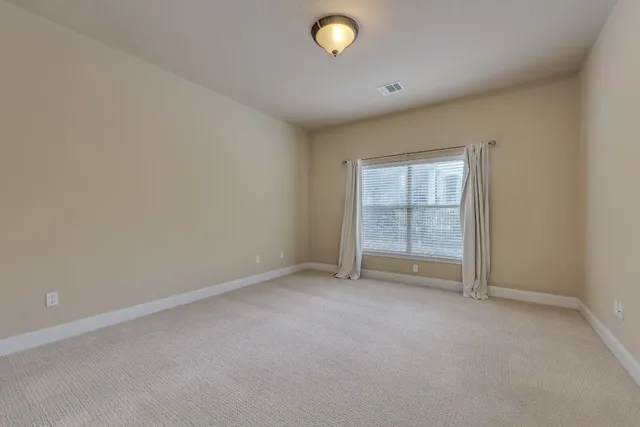 a view of a swimming pool with a yard