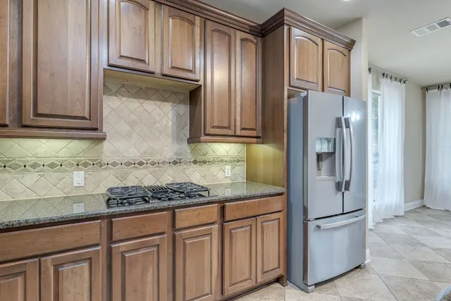 a kitchen with a sink a counter space and appliances