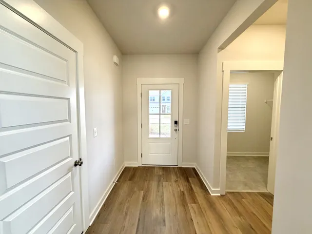 a white toilet sitting next to a white sink