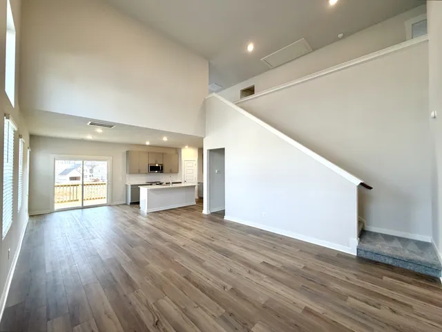 a view of kitchen with cabinets and wooden floor