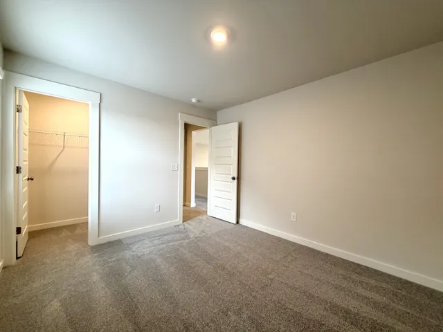 a bathroom with a double vanity sink toilet mirror and bathtub
