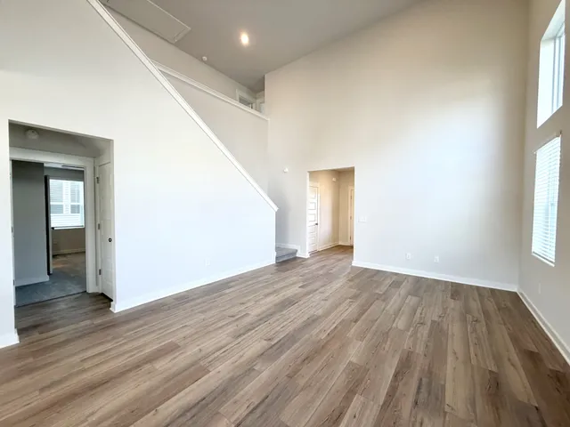 a view of kitchen with sink and wooden floor