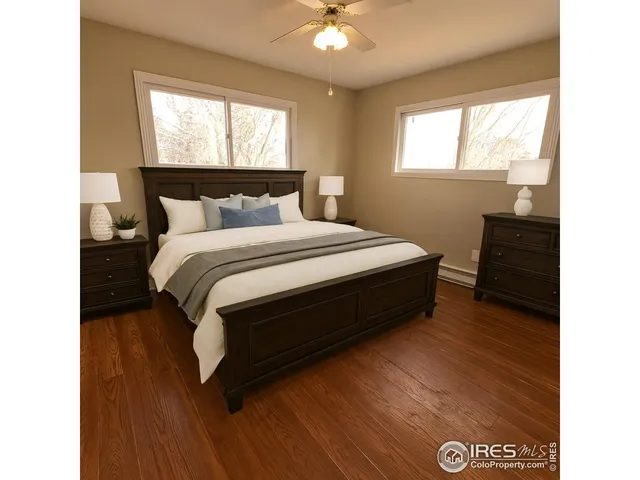 a spacious bedroom with a bed and window