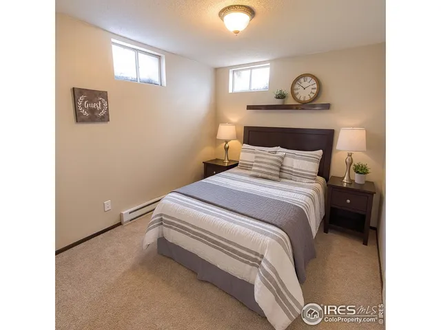 a bedroom with a bed and a table