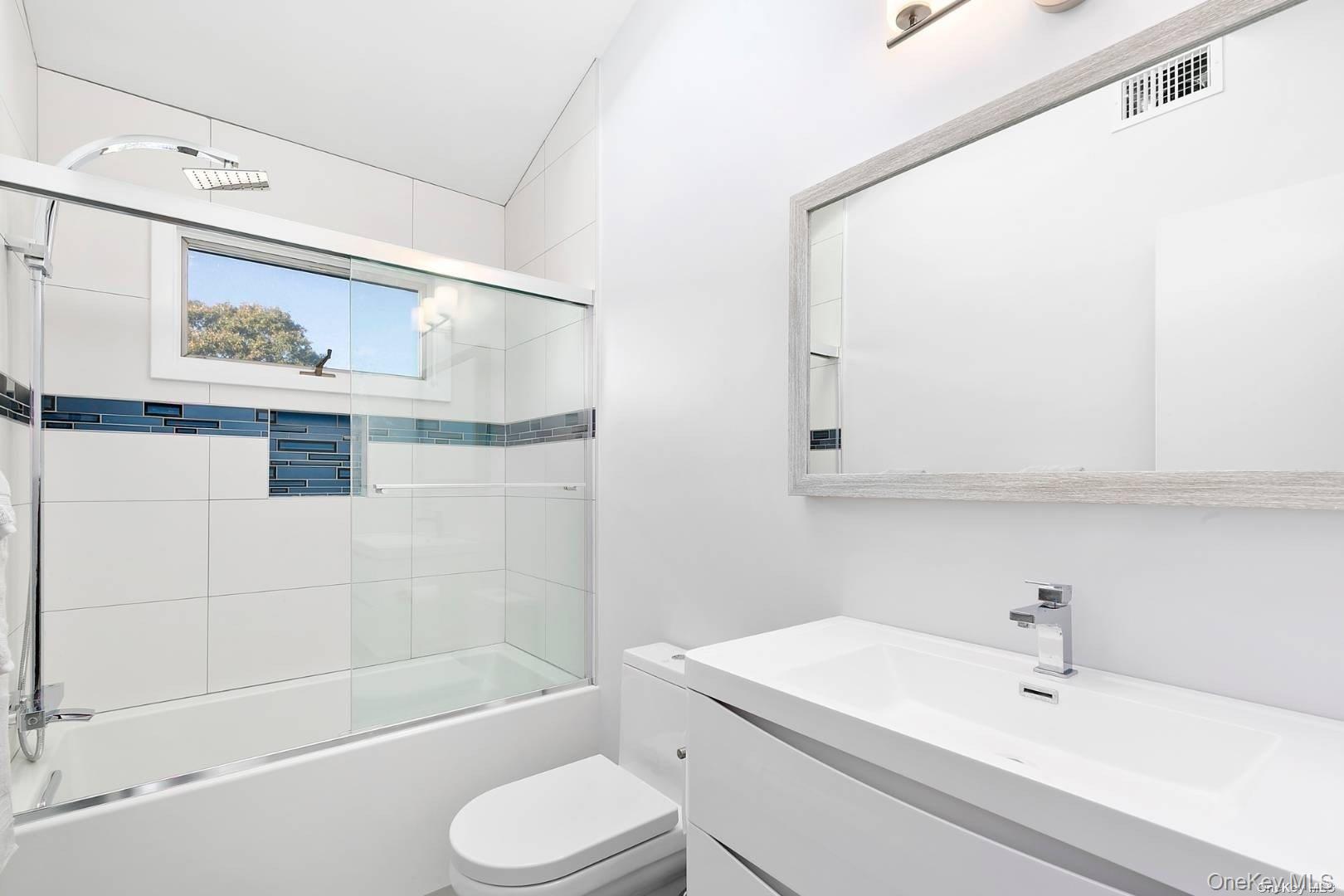 7 Harbor Road Hampton Bays, NY 11946 - Photo 11 of 22 a bathroom with a sink toilet and shower