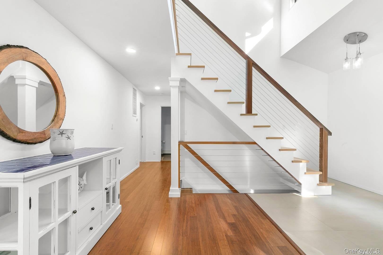 7 Harbor Road Hampton Bays, NY 11946 - Photo 5 of 22 a view of entryway and hall with wooden floor