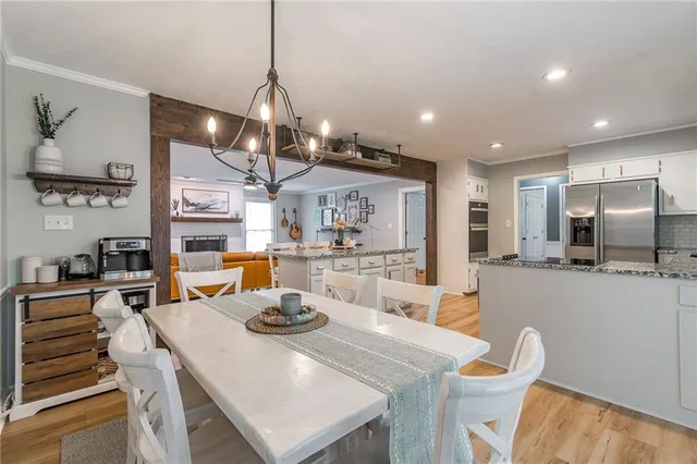 a large kitchen with a table and chairs