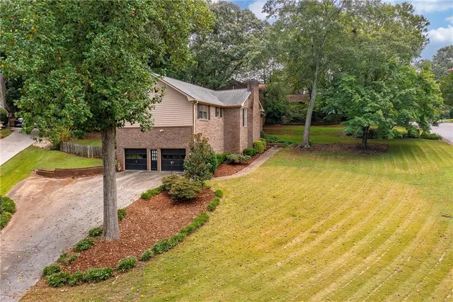 a house with swimming pool in front of it