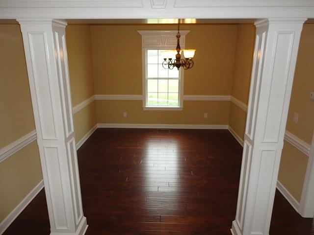 6787 Maple Springs Road Manchester, TN 37355 - Photo 7 of 20 The dining room with lots of upscale molding and hardwoods.