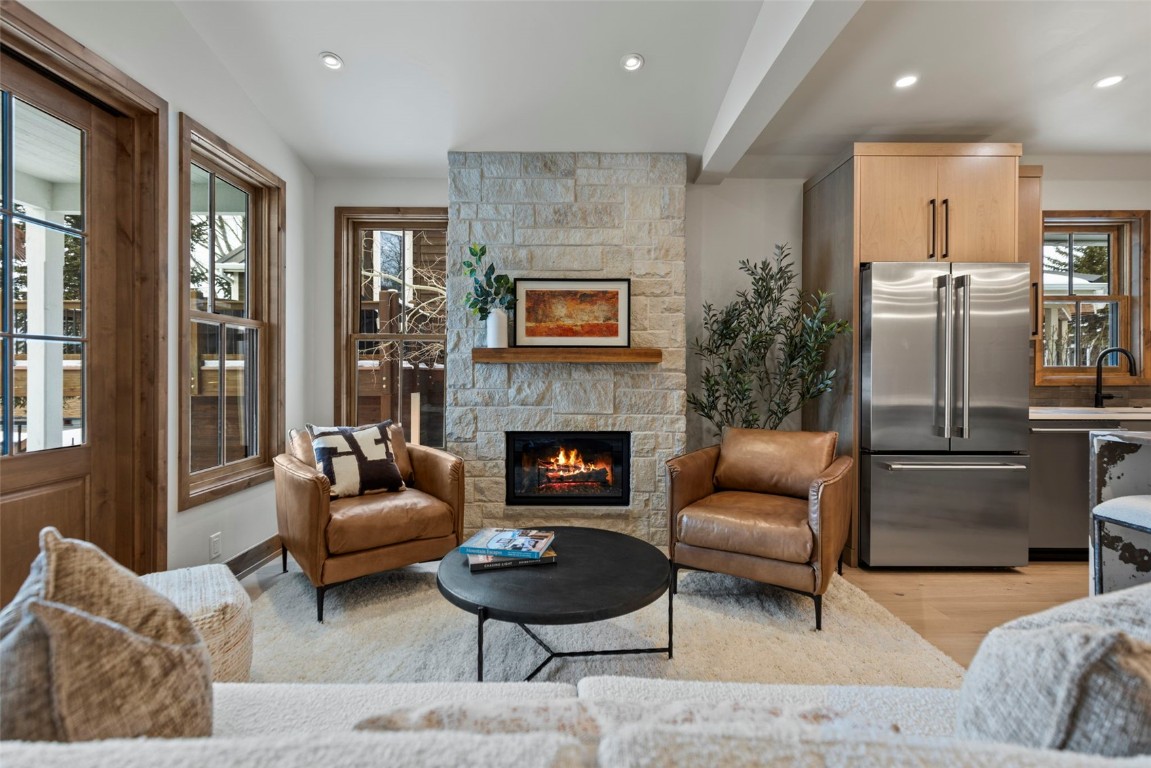 203 North Ridge Street, Unit B Breckenridge, CO 80424 - Photo 12 of 49 Living room featuring a fireplace, recessed lighting, light wood finished floors, and beam ceiling