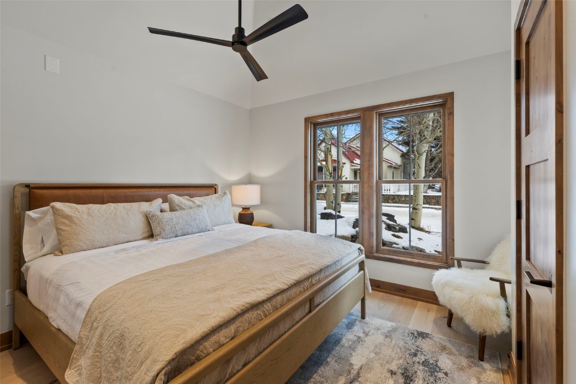 203 North Ridge Street, Unit B Breckenridge, CO 80424 - Photo 18 of 49 Bedroom featuring light wood finished floors, ceiling fan, and lofted ceiling