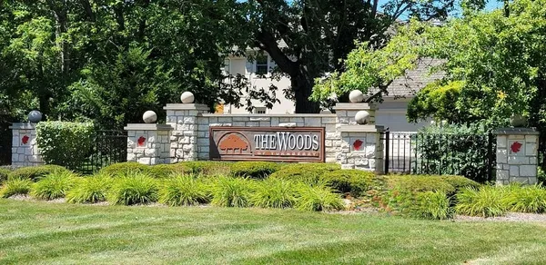a view of a sign board with a house