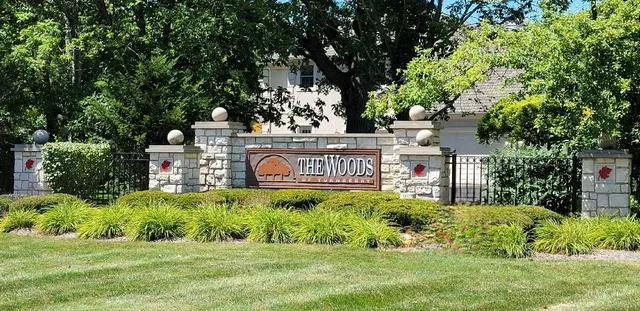 a view of a sign board with a house