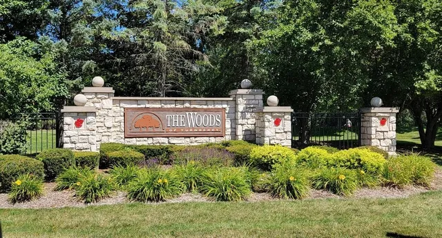 a view of a sign board with yard