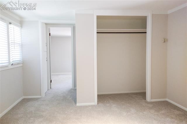 1529 West Cheyenne Road Colorado Springs, CO 80906 - Photo 11 of 17 View of entry to back bedroom from front bedroom