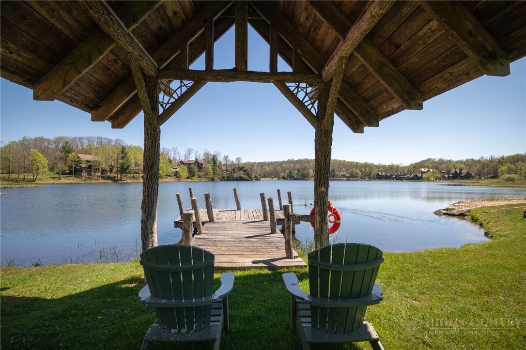 Owls Brow Ridge Blowing Rock, NC 28605 - Photo 20 of 32 a view of a lake with couches and city view